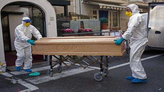 Medical staff wearing protective suits carry the coffin containing the body of Assunta Pastore, 87, after she passed away in her room at the Garden hotel in Laigueglia, northwest Italy, Liguria region, Sunday March 1, 2020. The woman, part of a group of elderly tourist from the Lombardia region, tested positive of the COVID-19. The hotel has been placed under quarantine as Italy continued to scramble Sunday to contain the spread of the corona virus. (AP Photo)
