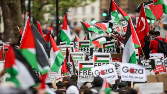 LONDON, UNITED KINGDOM - MAY 11: Pro-Palestinian demonstrators holding banners and Palestinian flags gather to protest against Israeli air raids on Gaza Strip outside Britain's PM Office in Downing Street, London, United Kingdom on May 11, 2021. Demonstrators chant "Free Palestine!" demanding the commitment of Great Britain to end their support for Israel. They also oppose to Israeli planned evictions of Palestinian families in the Sheikh Jarrah neighbourhood of East Jerusalem. This is the second week of ongoing protests to be held across England. ( Vudi Xhymshiti - Anadolu Agency )