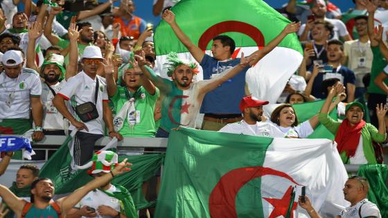 Algeria fans cheer for their team prior to the 2019 Africa Cup of Nations (CAN) Round of 16 football match between Algeria and Guinea at the 30 June Stadium in the Egyptian capital Cairo on July 7, 2019. (Photo by MOHAMED EL-SHAHED / AFP)