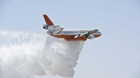 A DC-10 Tanker with the U.S. Forest Service demonstrates a water drop during "Thunder Over The Empire Air Fest" at March Air Reserve Base, Calif., May 19, 2012. Air Fest 2012 features military and civilian ground and aerial demonstration during a two-day show.