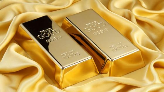 45451782 - gold bars on golden silk